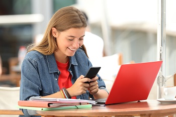 Female student distracted by her cell phone