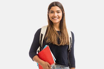 Female student carrying some notebooks